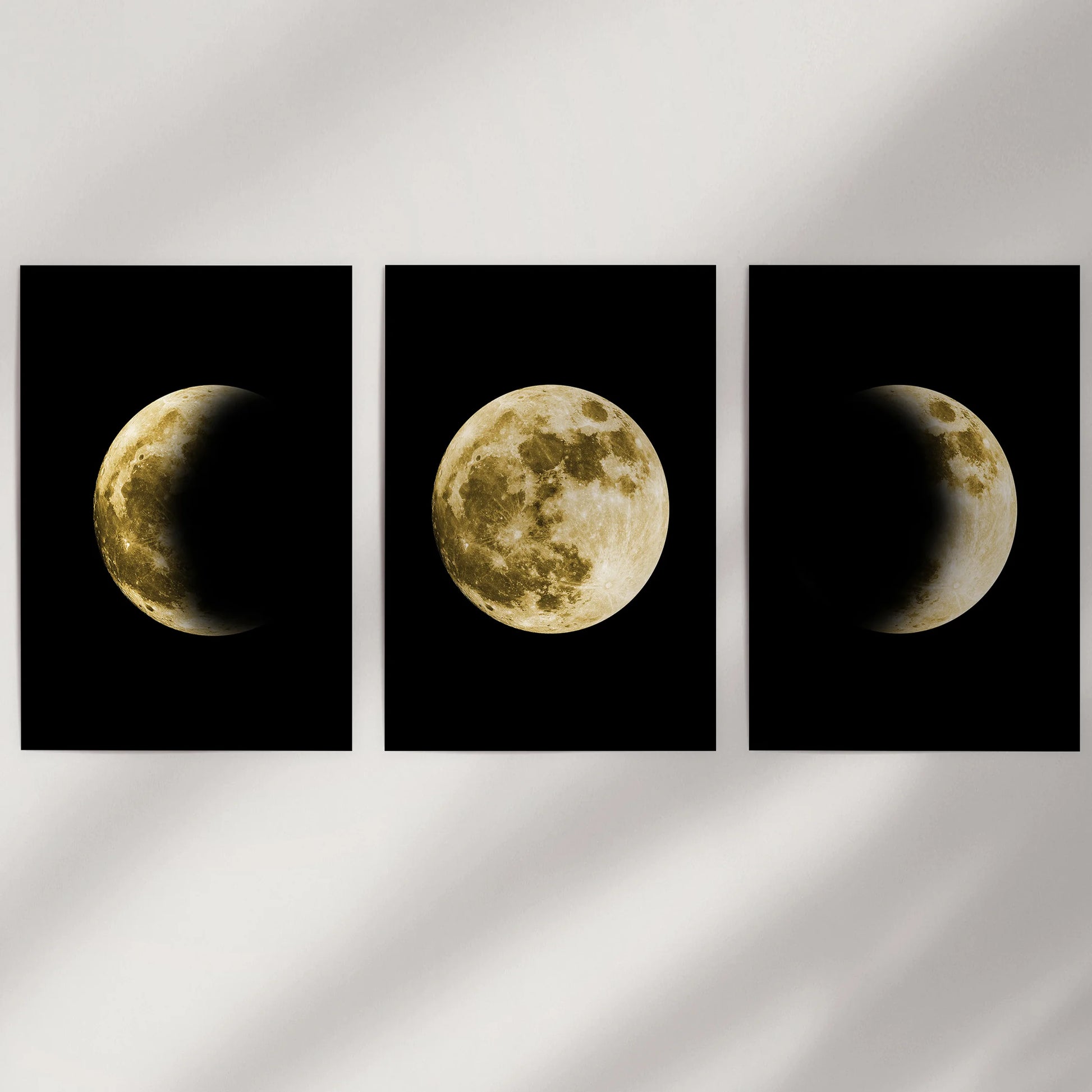 A trio of unframed lunar phase art prints ships rolled in a tube, ready to form a gleaming moon triptych against any blank wall.
