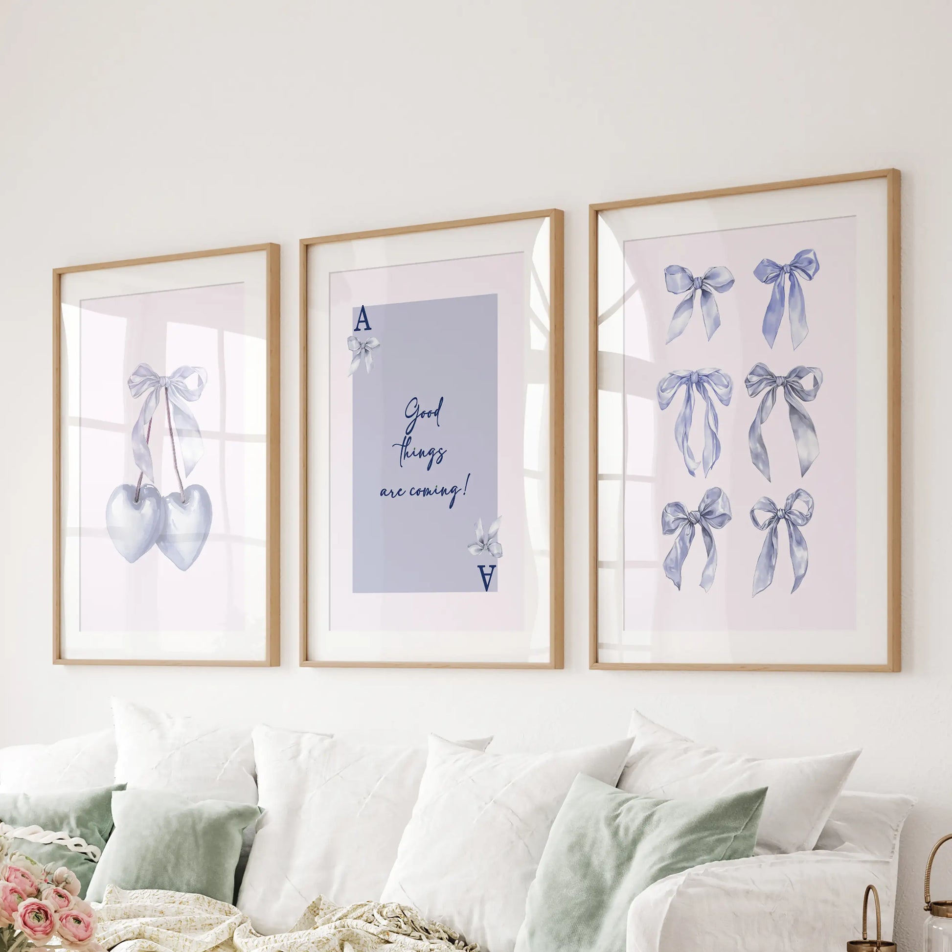 Ace of Hearts playing card wall prints, set of three, sit neatly in oak frames with mats over the sofa, giving the living room a lucky light-blue accent.