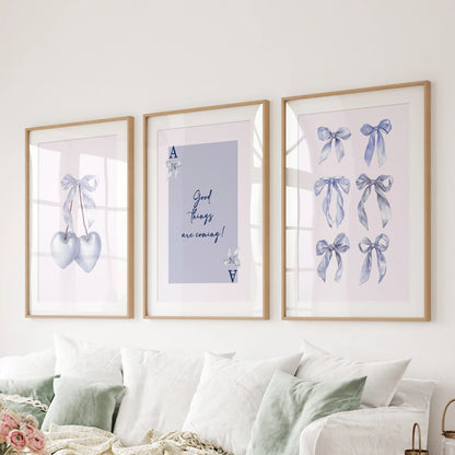 Ace of Hearts playing card wall prints, set of three, sit neatly in oak frames with mats over the sofa, giving the living room a lucky light-blue accent.