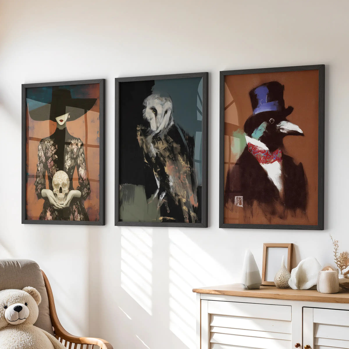 Gothic cottagecore set of three wall prints in black frames, displayed over a dresser in a kids room.