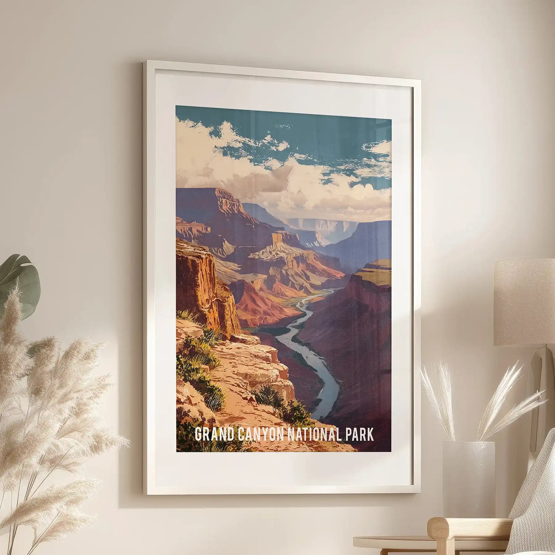 A statement art print of Arizona’s burnt-orange canyons in a white frame and mat centers the lounge above the chair, warming the space.