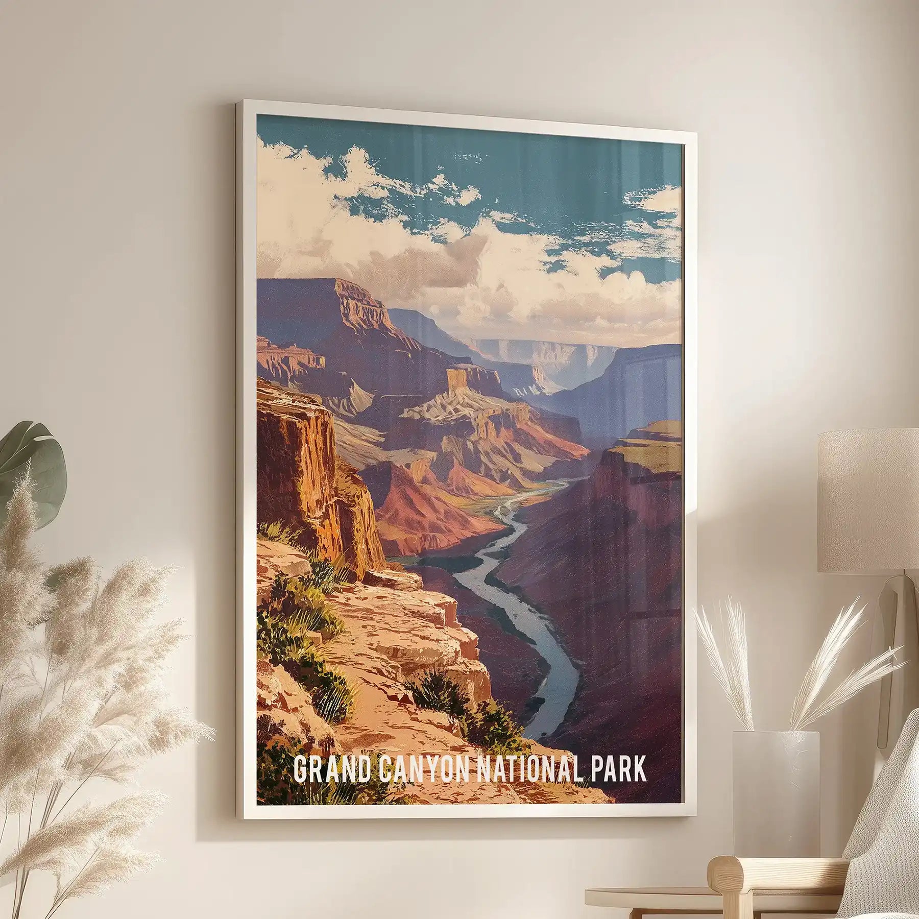 White-framed wall decor of Southwest desert cliffs hangs over a reading chair in the lounge, highlighting the canyon’s pale strata.