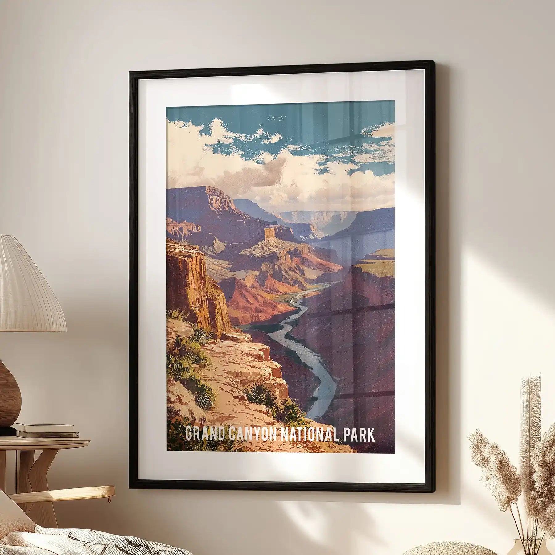 Terracotta canyon cliffs decorative wall art sits above a cozy lounge chair, the black mat frame sharpening the vintage Southwest tones.