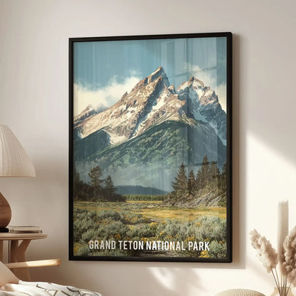 Grand Teton mountain range art print for wall in a black frame rests beside a reading chair in the lounge, bringing rugged peaks and deep green forest to the nook.