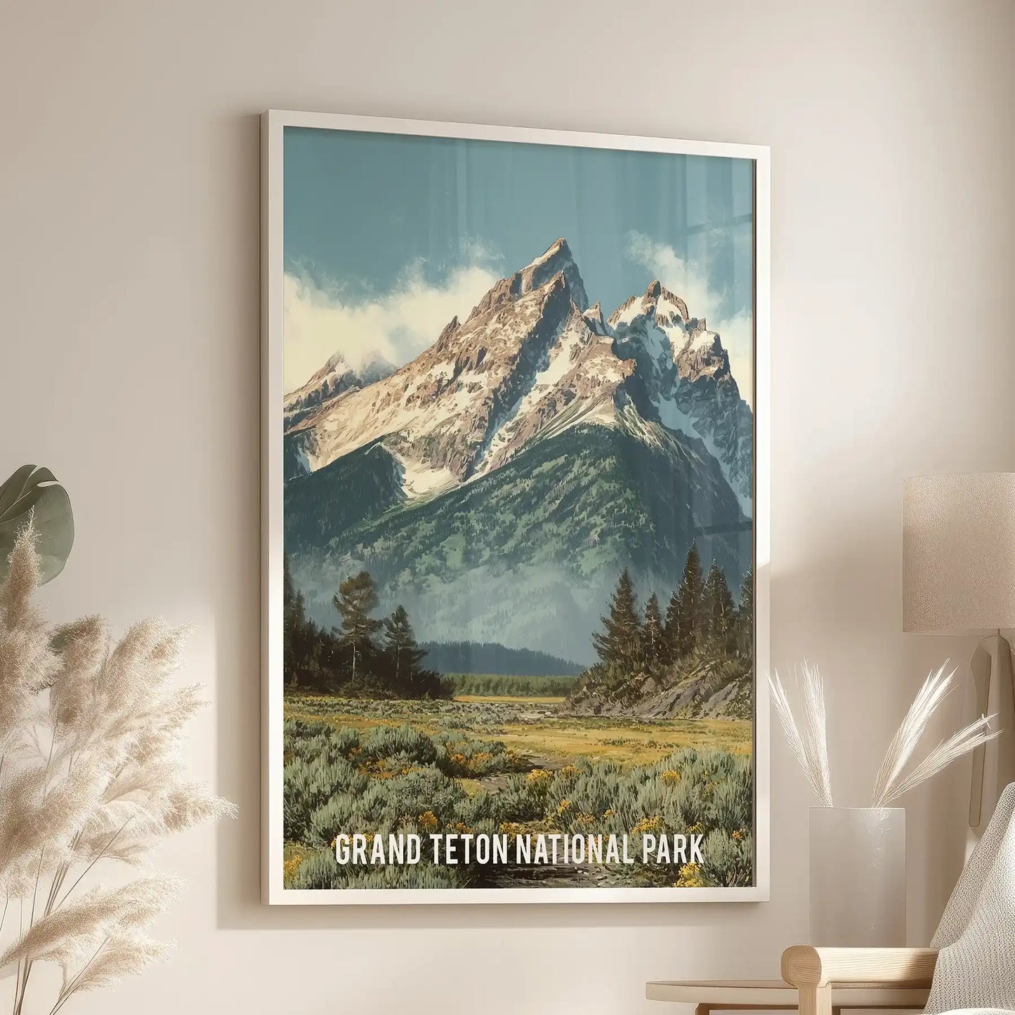 A white-framed wall art piece of Western peaks hangs above the lounge chair, adding crisp contours and open-sky drama to the seating area.