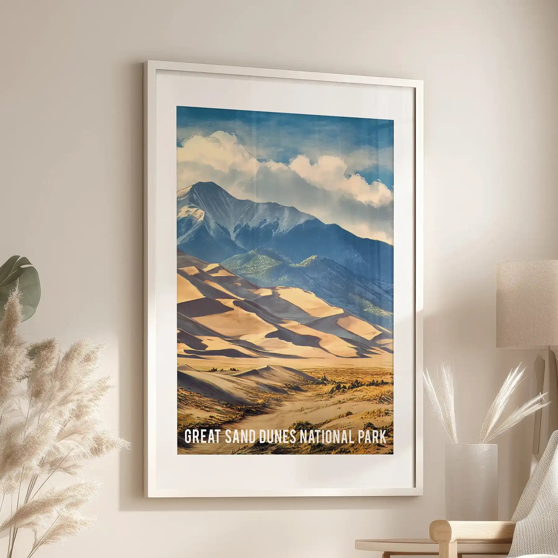 A single sand-beige dunes poster matted in white and hung above an armchair lends airy texture and a boho note to a modern sitting room.