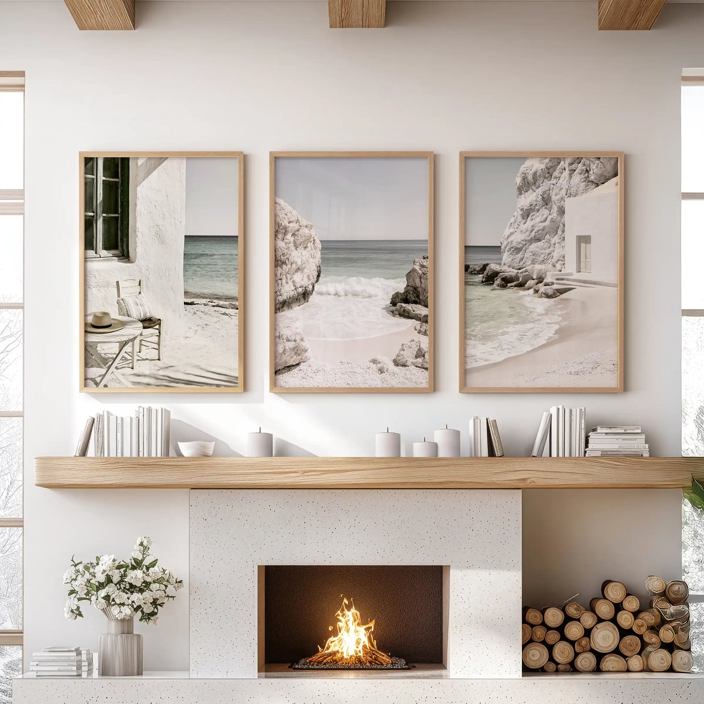 A set of 3 art prints depicts Greek seaside beaches in wood frames, displayed above the mantle to create a relaxed focal wall in the sitting room.