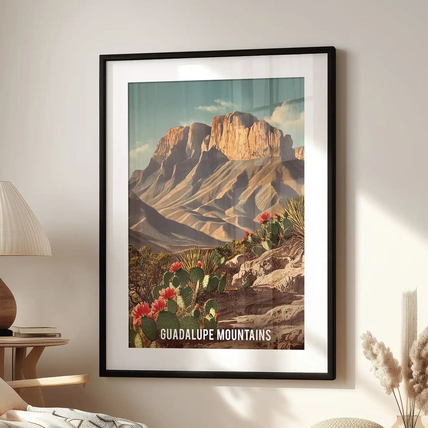 McKittrick Canyon wall poster with a black matted frame, placed over a cozy chair in the lounge, showcases sunlit cliffs and fall foliage in timeless park art.