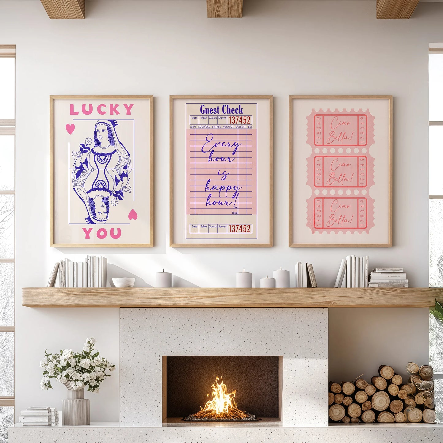 Pink playing card art prints, a three-piece wall hanging in natural wood frames, elevate the family room space over the fireplace with jaunty color.