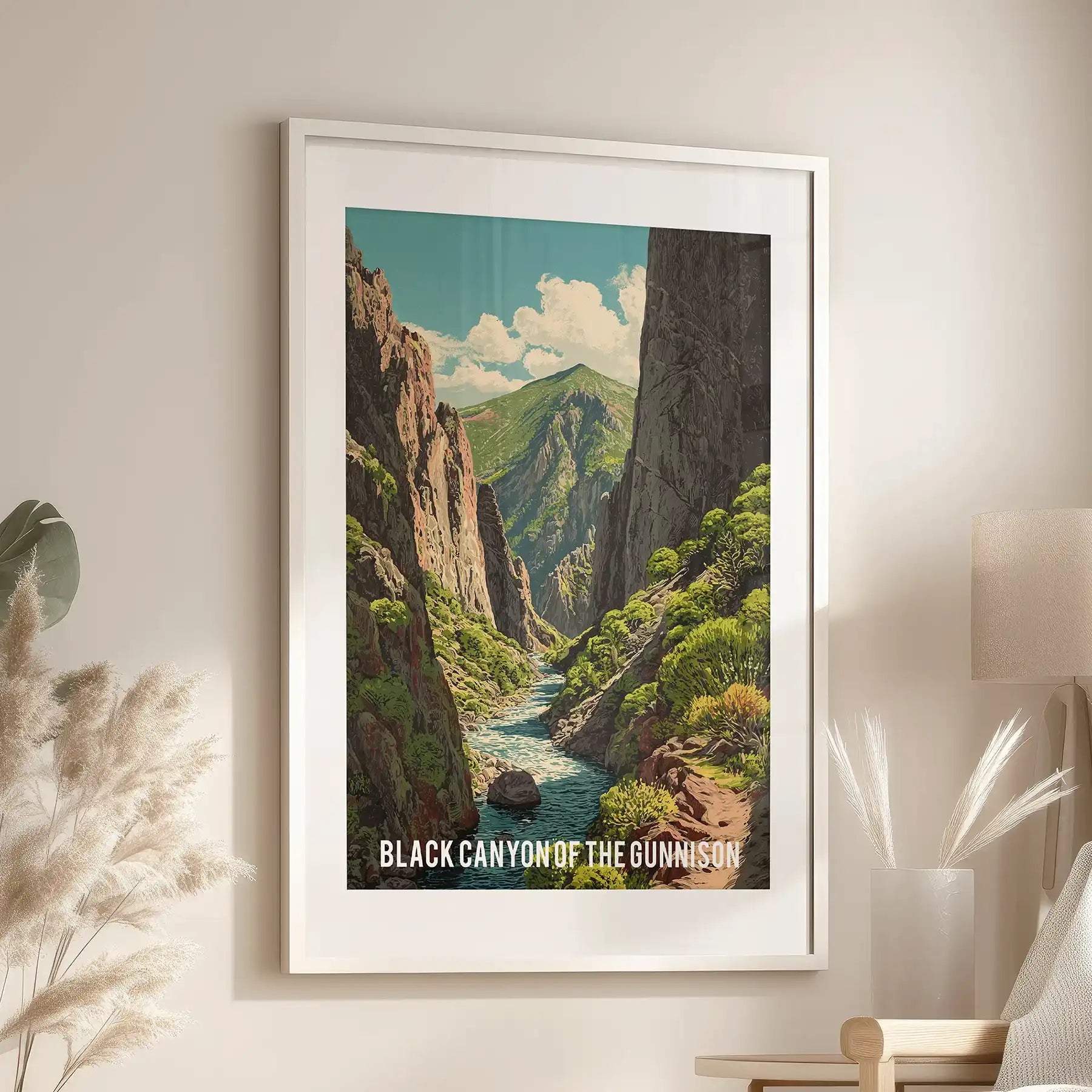 Framed wall artwork of the Black Canyon of the Gunnison, complete with white matting, brings quiet drama to a sitting room above a reading chair.