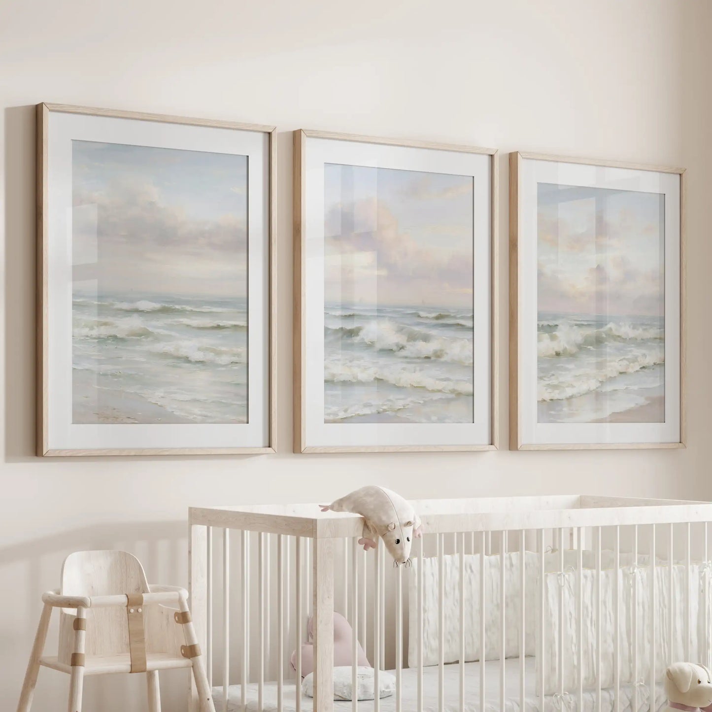 Calm coastal waters, a set of three prints matted and set in warm wood frames, soothe the infant room when hung over the cot.