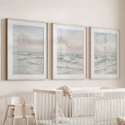 Calm coastal waters, a set of three prints matted and set in warm wood frames, soothe the infant room when hung over the cot.