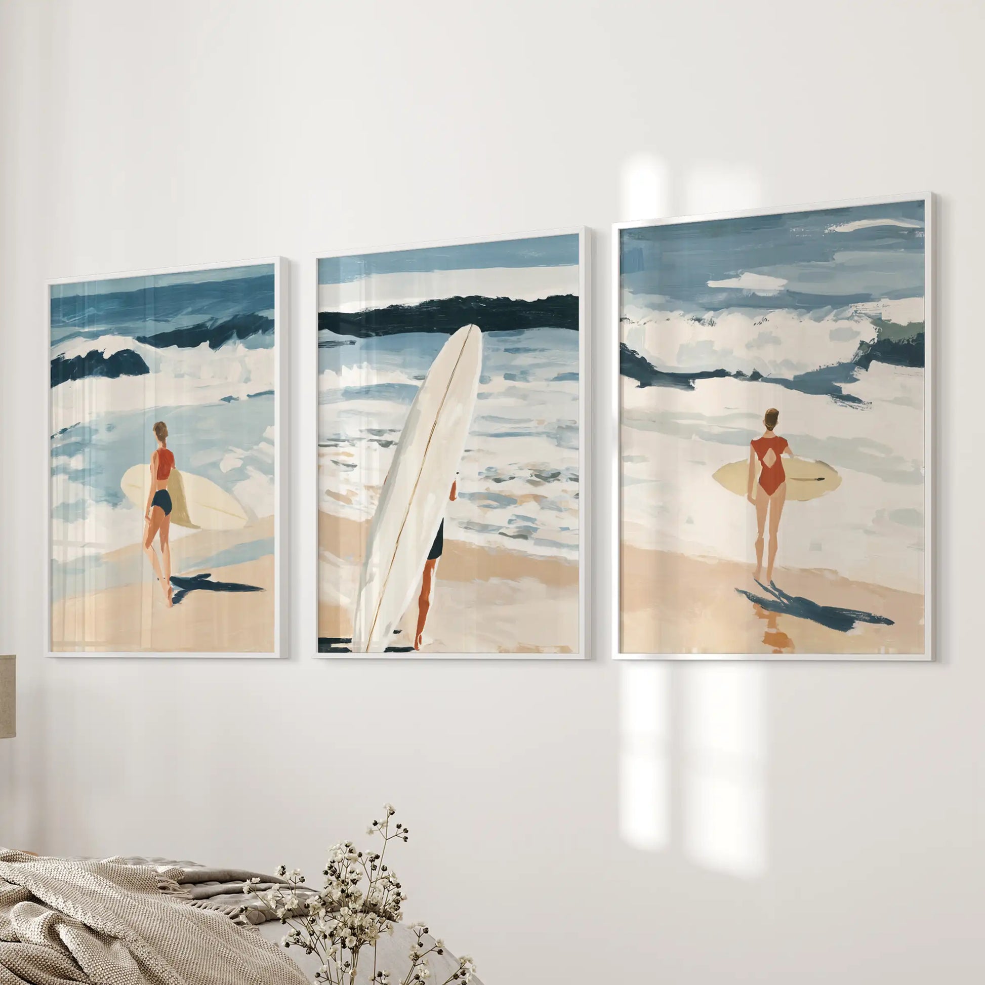 Surfer scenes, a 3-piece poster set in white framed prints, adds an easy summer note near the bed wall in the bedroom.