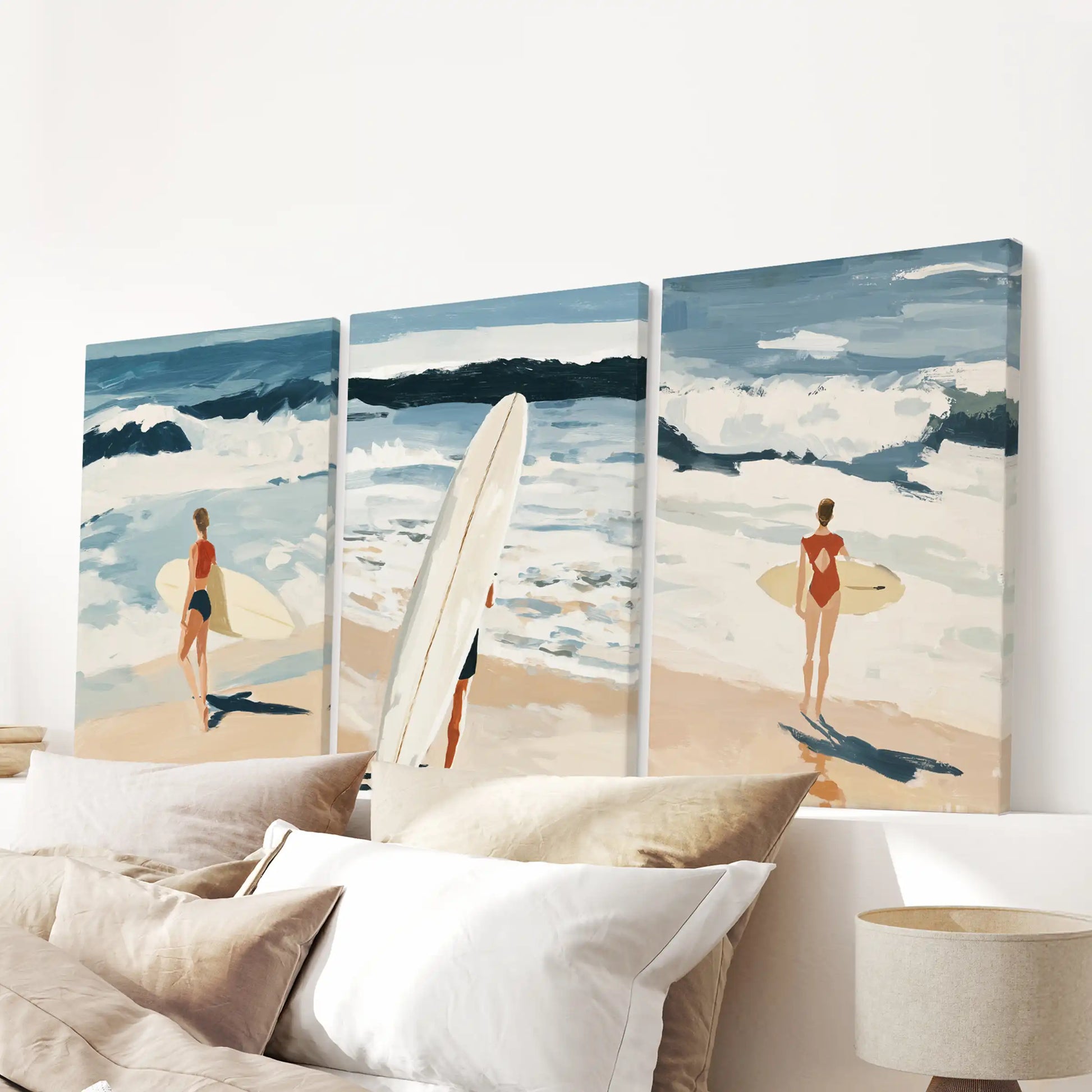 A 3-piece stretched canvas of ocean waves anchors the bedroom above the headboard with crisp surfside texture.