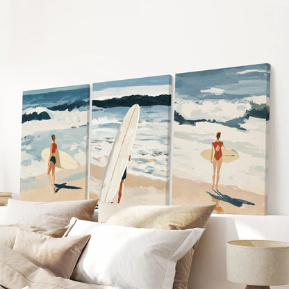 A 3-piece stretched canvas of ocean waves anchors the bedroom above the headboard with crisp surfside texture.