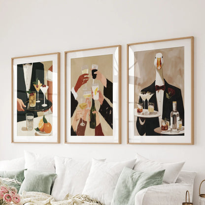 Happy hour wall art in a 3-piece poster set, hung in matted oak frames behind a lounge couch.