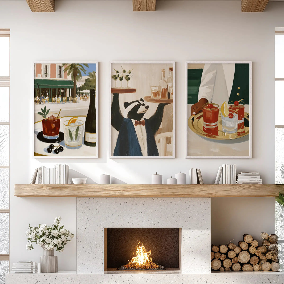 Set of three wall posters featuring happy hour drinks, shown in white frames over the family room fireplace.