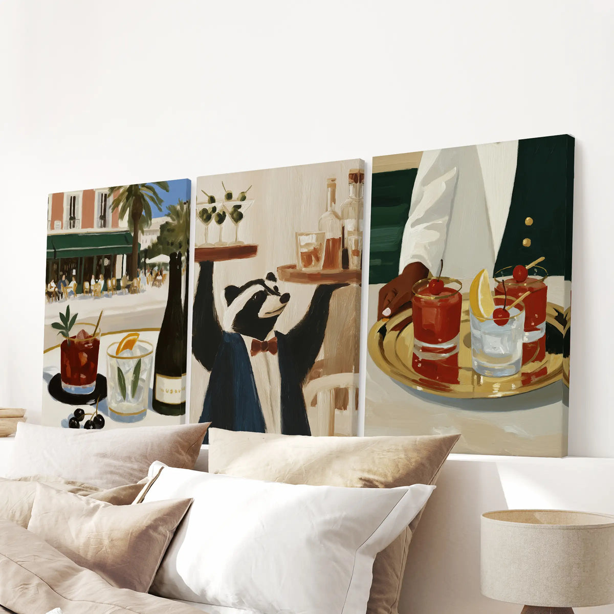 Happy hour drinks in a three-piece wall art set, printed on wrapped canvases and displayed above the headboard in a bedroom.