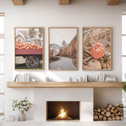 Three oak-framed harvest field prints rest above the sitting-room mantel, filling the space with golden grain hues and open-sky calm.
