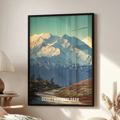 A standalone wall poster of Denali’s glacier peaks in a sleek black frame, brightening the sitting room beside a modern accent chair.