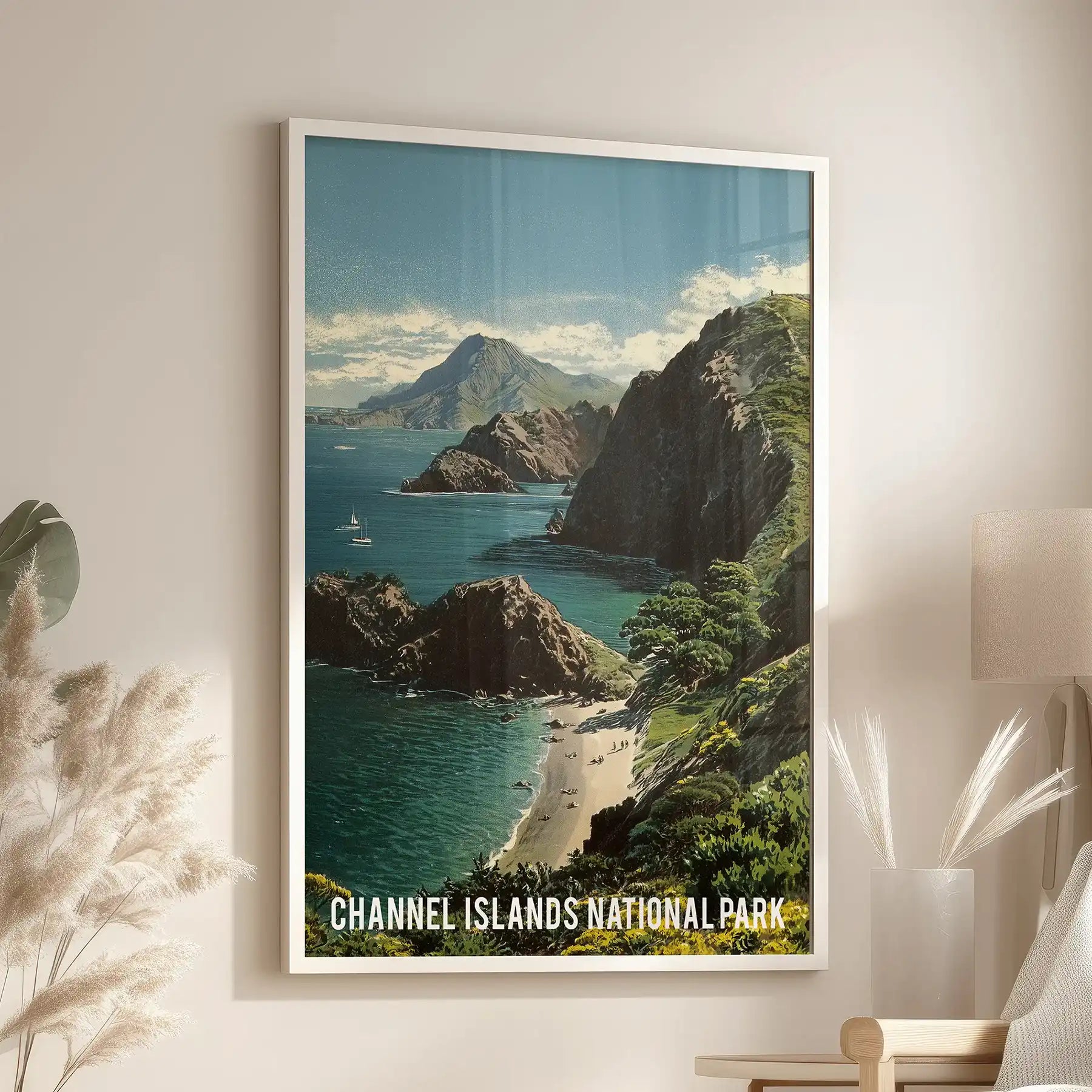 Retro national park travel poster gallery wall print in a crisp white frame, mounted above a reading chair in the lounge, lending bold, timeless coastal color.