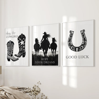 A white-framed set of three horseshoe prints hangs beside the bed, offering gentle Western imagery and a quiet sense of good luck.