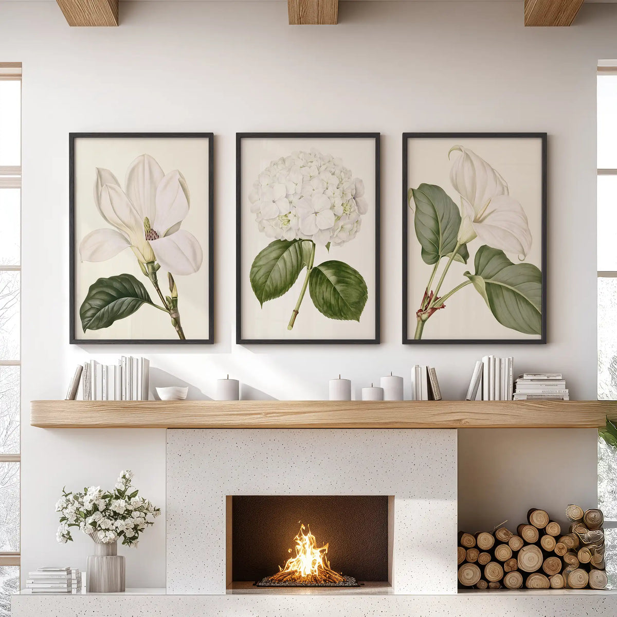 The middle of three black-framed prints above a fireplace shows a round white hydrangea; larger blossoms and green leaves fill the outer pictures.