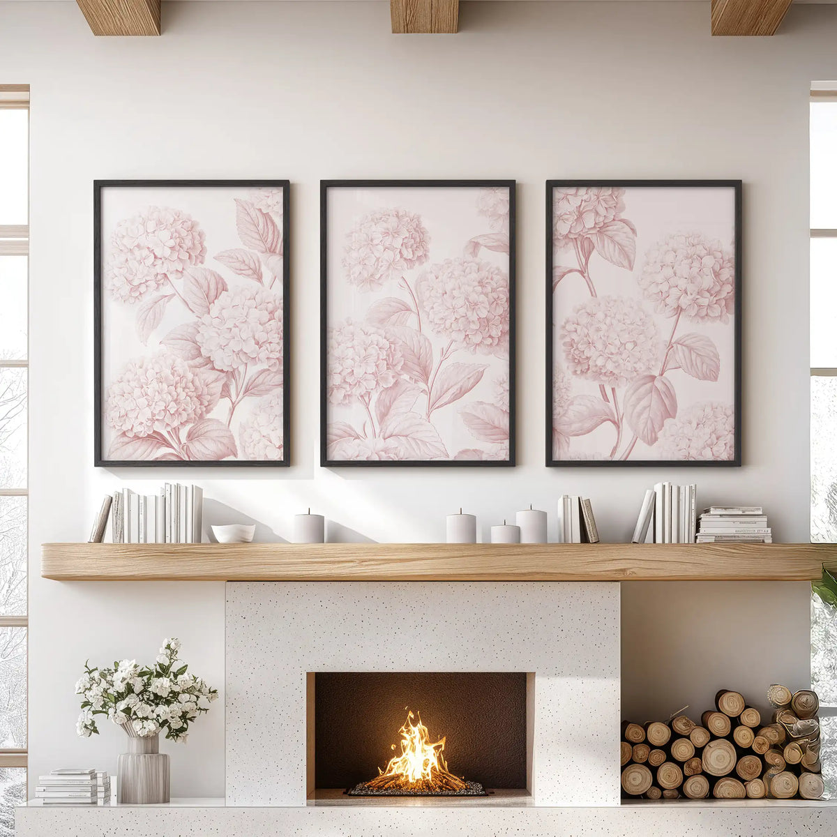 Pink hydrangea patterns fill three black-framed prints above a fireplace.