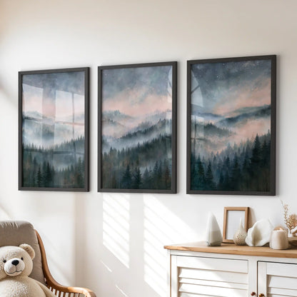 Three misty mountain forest prints form a wall art set in black frames, creating a calm focal point above the playroom dresser.