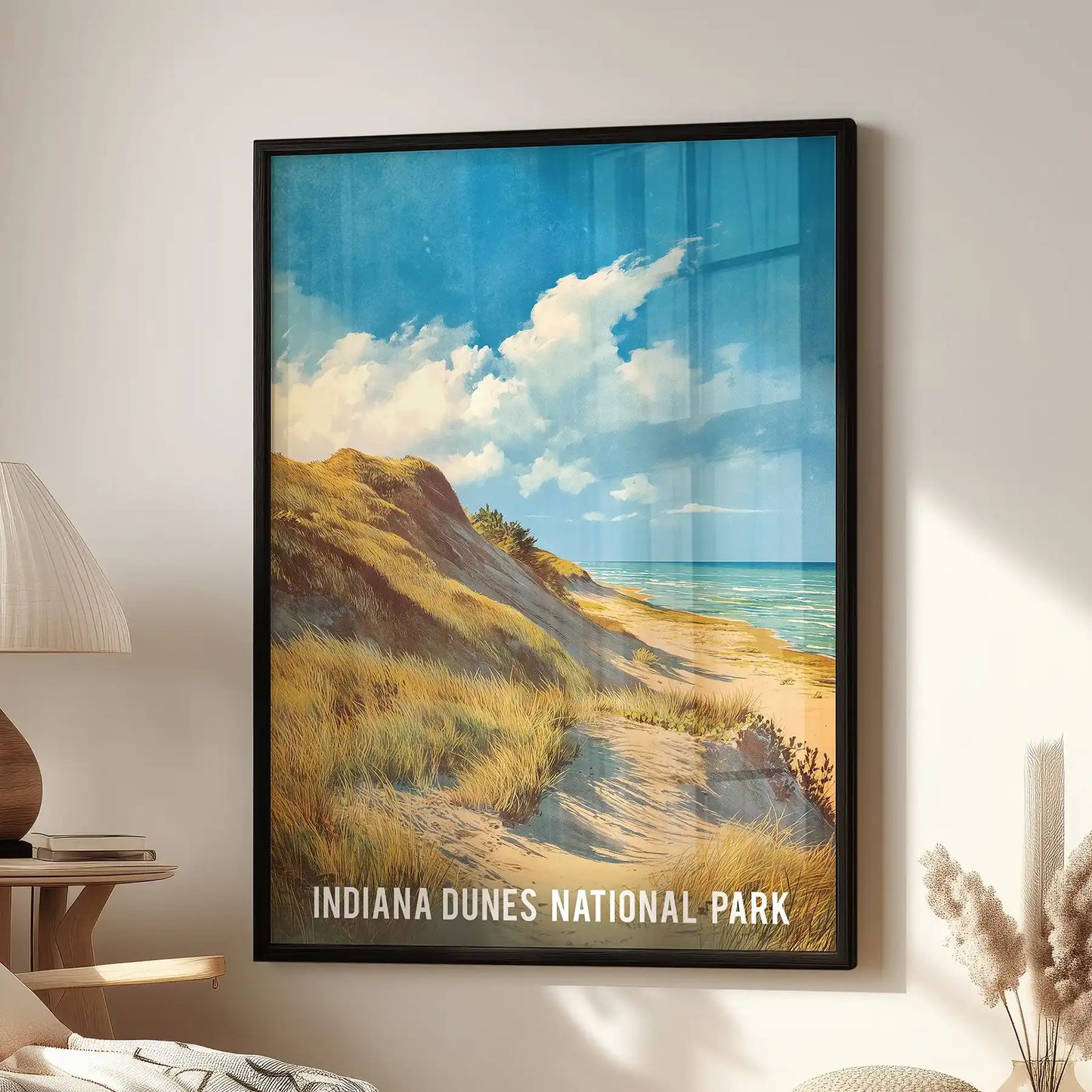 A National Park landscape art print in sleek black framing hangs above a lounge chair, lending crisp modern character to the wall.