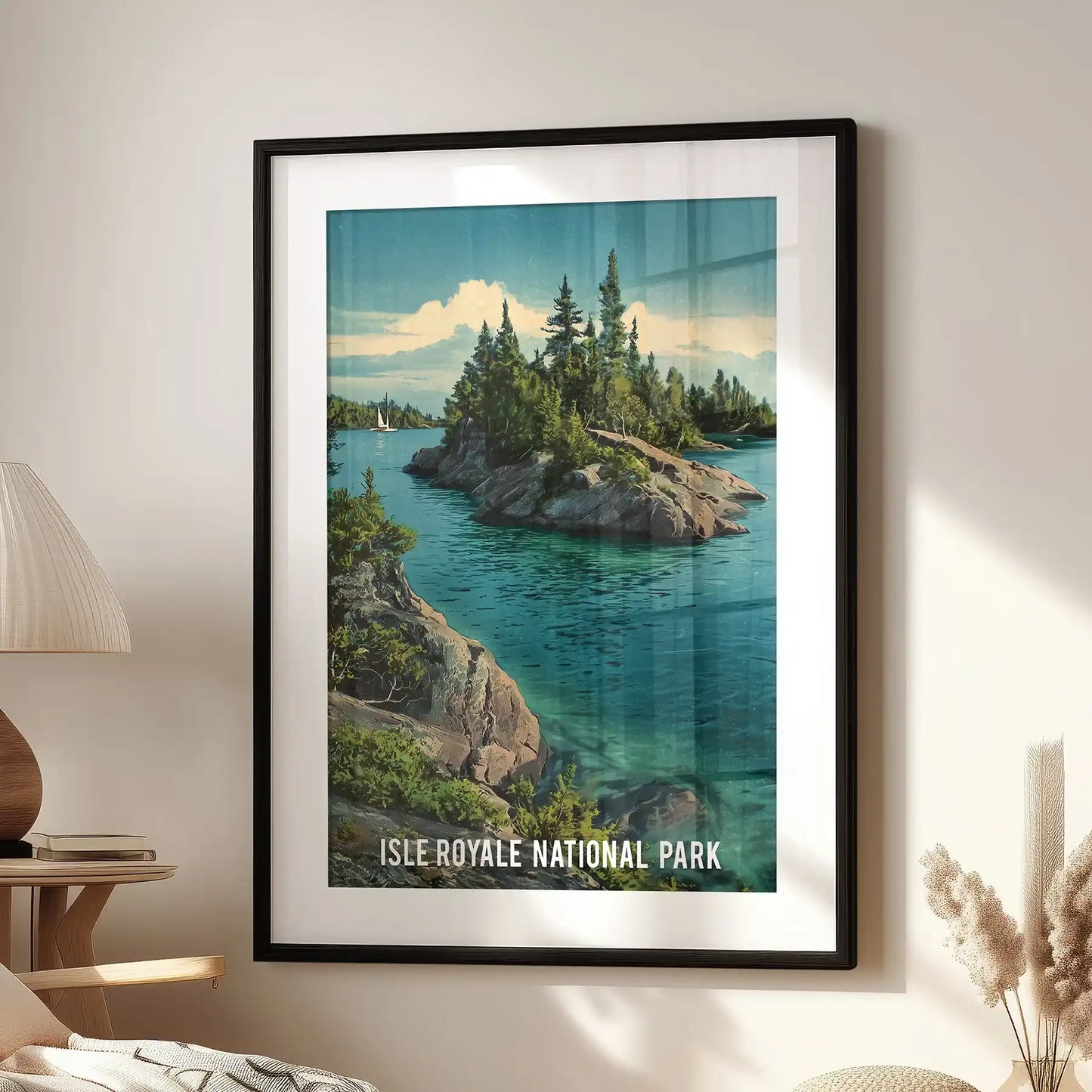 Single poster wall art of Isle Royale National Park, framed in black with a white mat, hangs near a reading chair for a serene living room view.