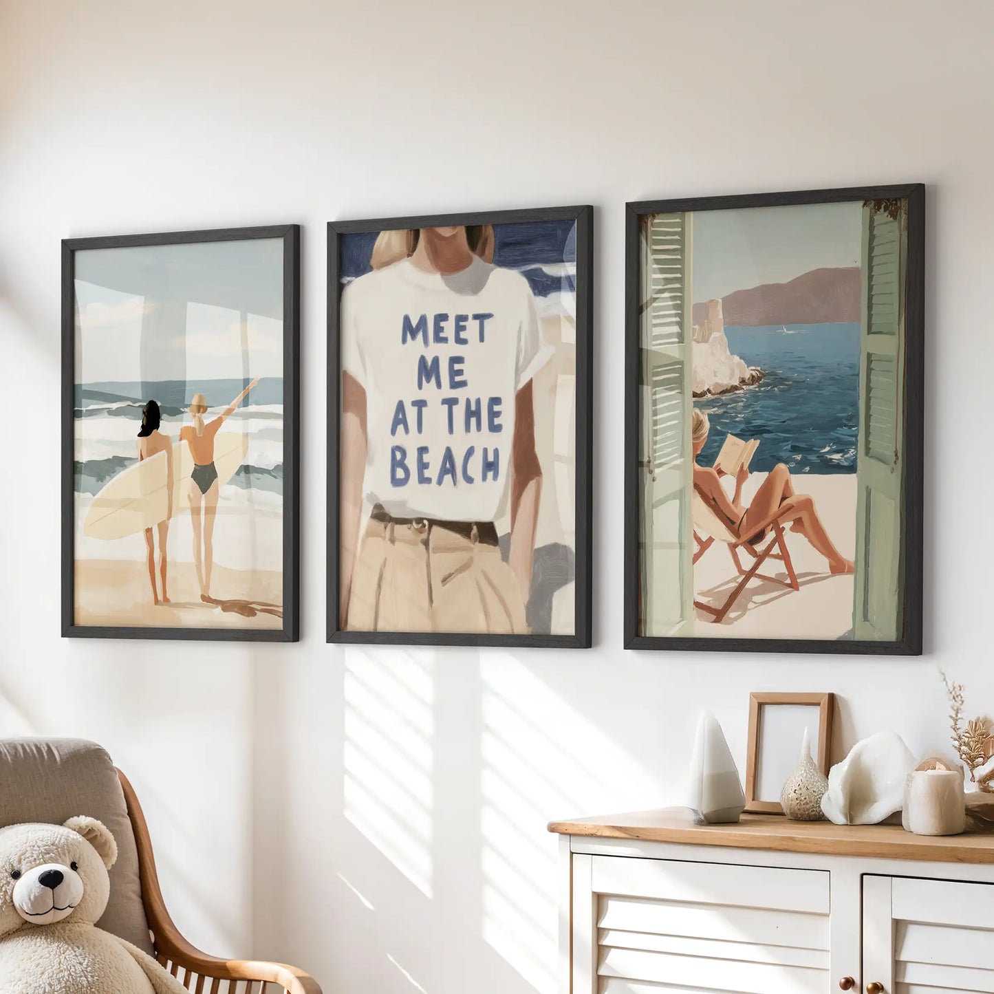 A fun three-print set with “Meet Me At The Beach” typography brightens the kids’ playroom, its black frames neatly spaced above the drawers.