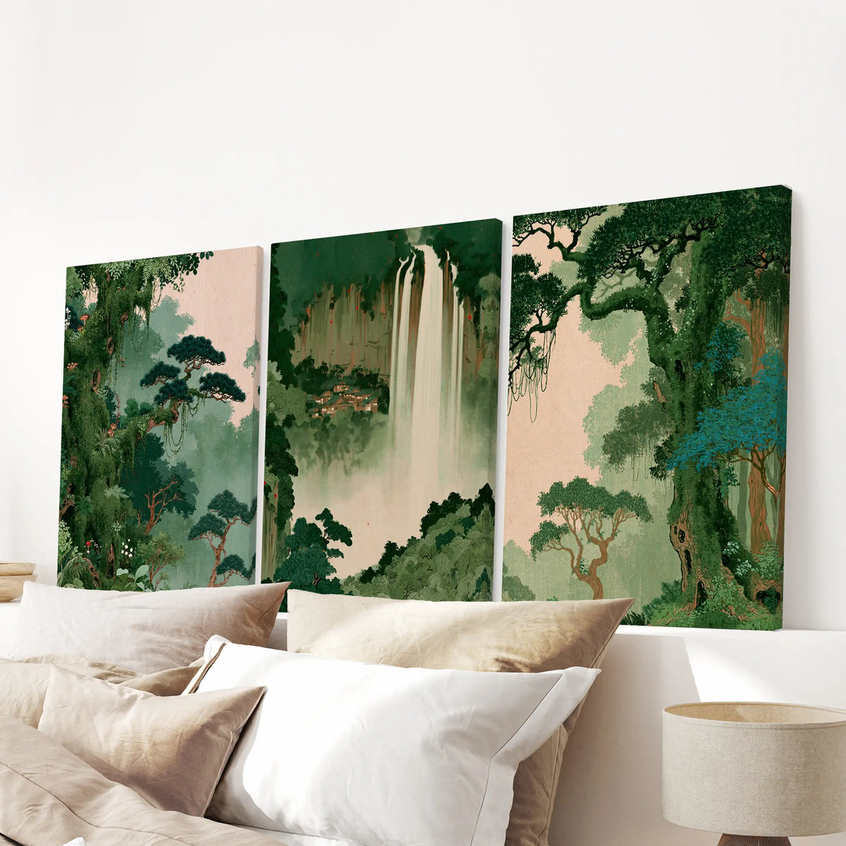Japanese tree wall art set of three canvas prints, arranged over the bed headboard in a bedroom with light walls and neutral bedding.