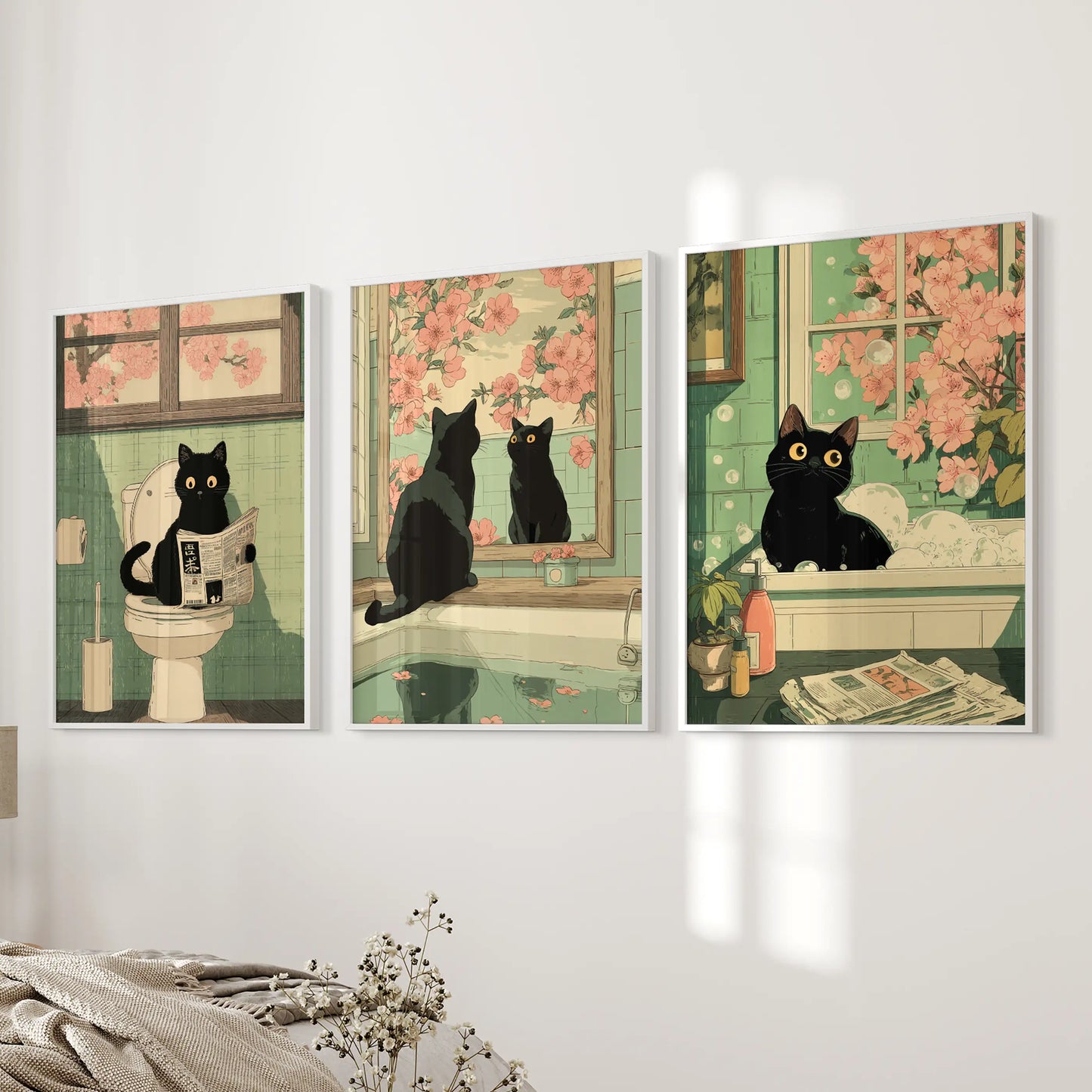 Vintage Japanese cat bathroom poster art, three-piece artwork, shown on a bedside wall with clean white frames in the bedroom.