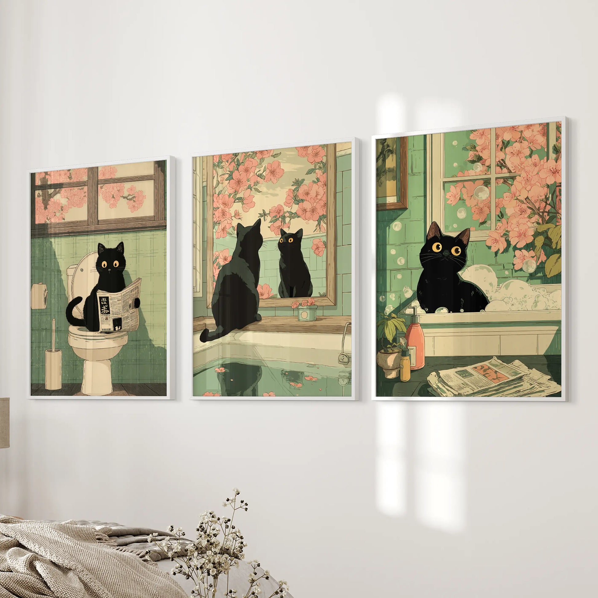 Vintage Japanese cat bathroom poster art, three-piece artwork, shown on a bedside wall with clean white frames in the bedroom.