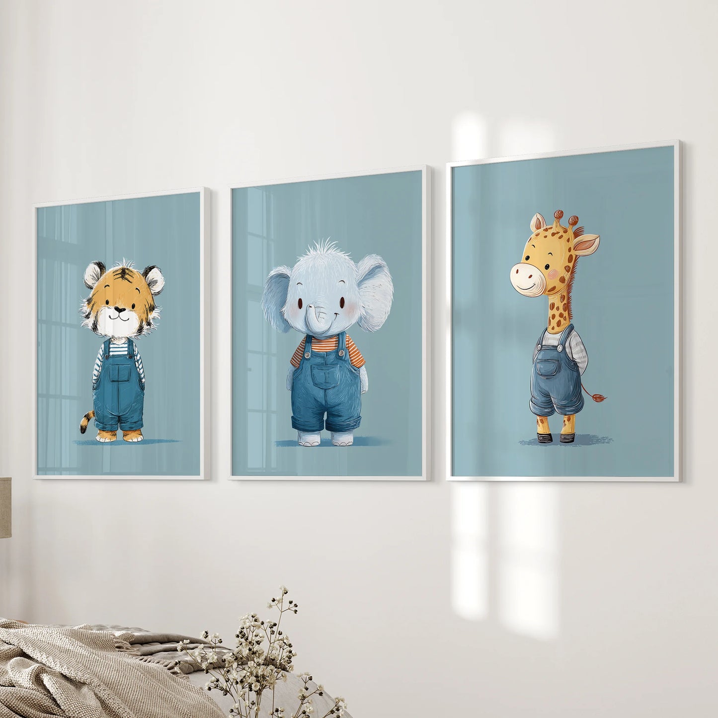 Playful blue animal posters, a three-piece print set in crisp white frames, hung on the wall beside the bedroom bed for a gentle safari accent.