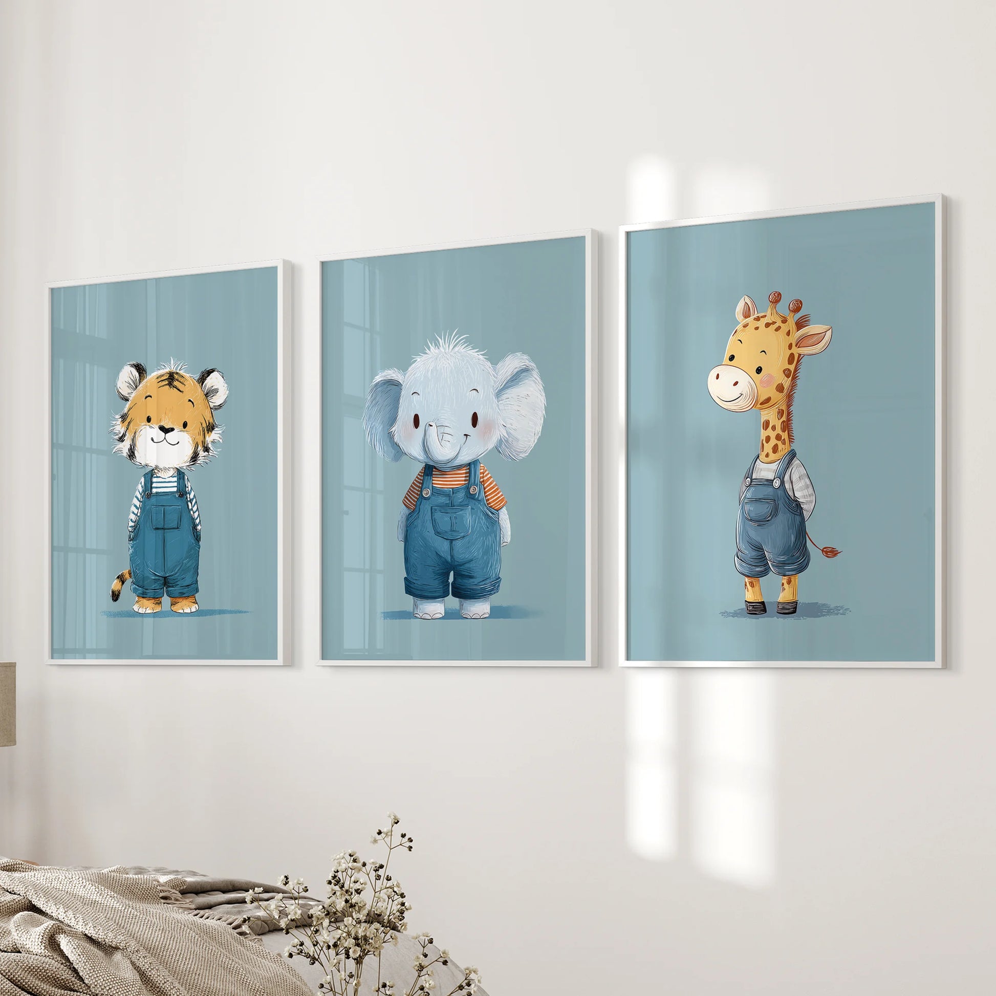 Playful blue animal posters, a three-piece print set in crisp white frames, hung on the wall beside the bedroom bed for a gentle safari accent.