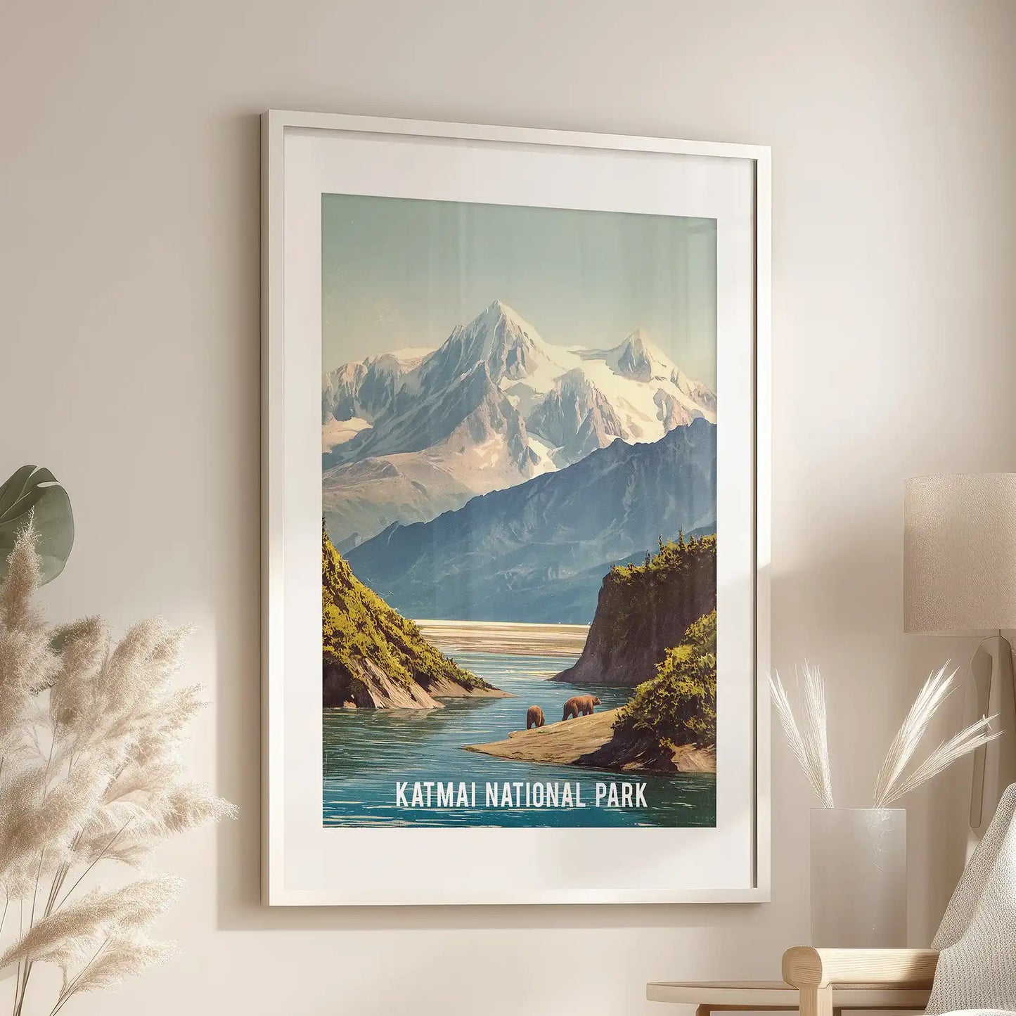 Statement wall print of Katmai’s river valley in a white matted frame, hung above a chair to blend calm waterways with snowy mountain tones.