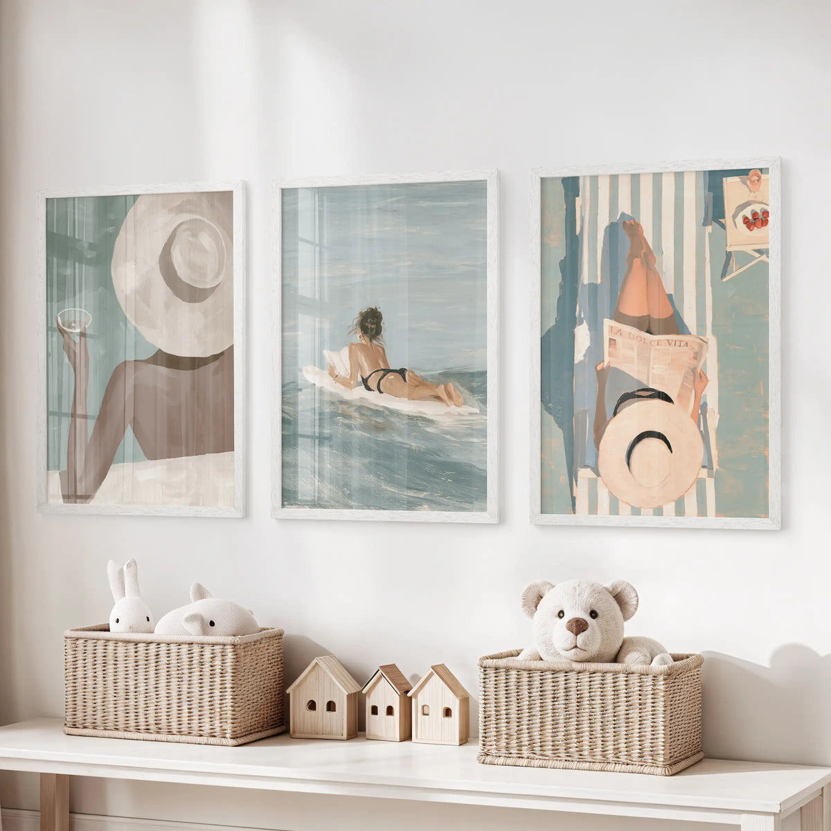 La Dolce Vita set of 3 wall prints hangs over a toy organizer in a playroom, each displayed in a white frame.