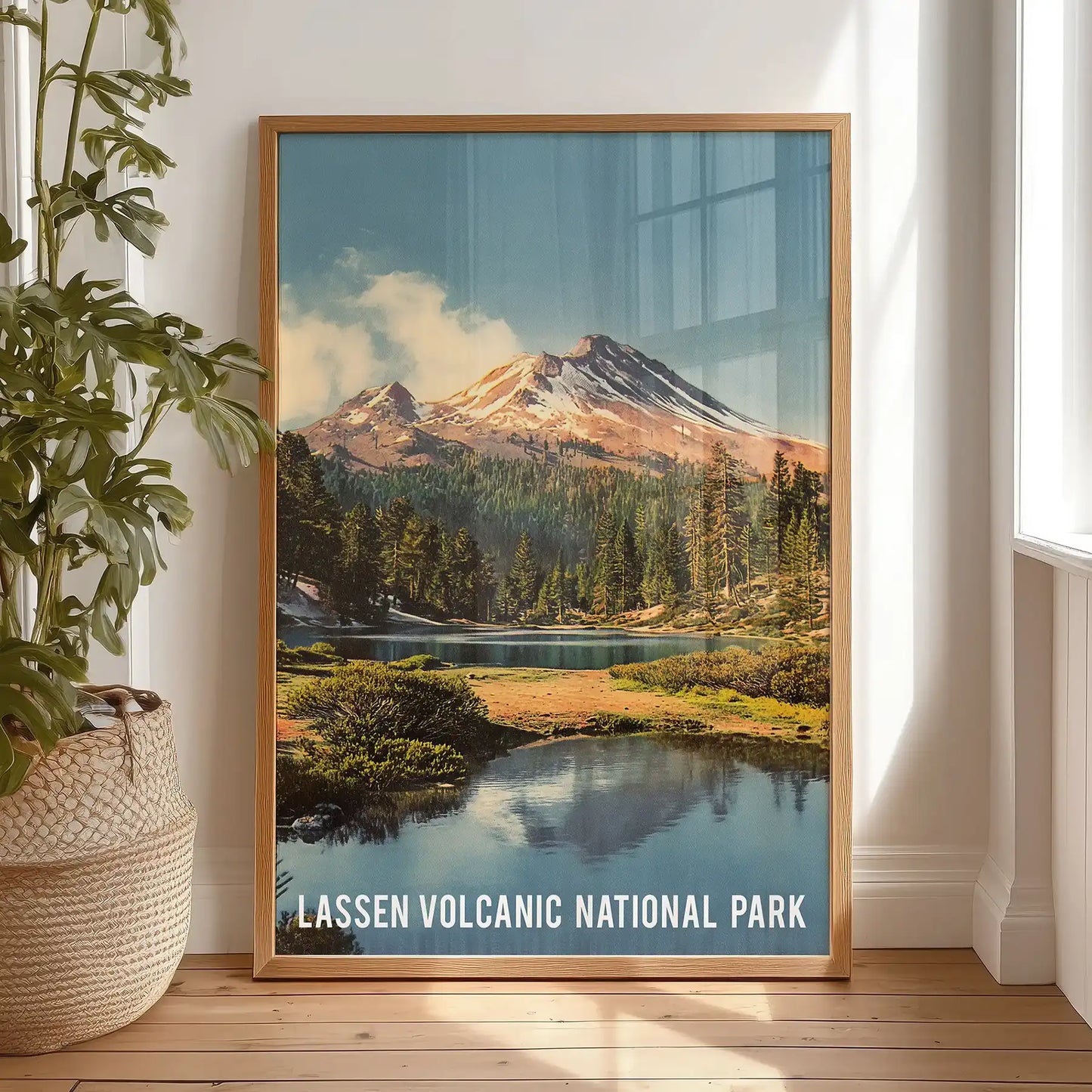 Lassen Peak volcanic mountain wall picture print in a natural wood frame leans against the bedroom wall, adding rugged elevation to the space.
