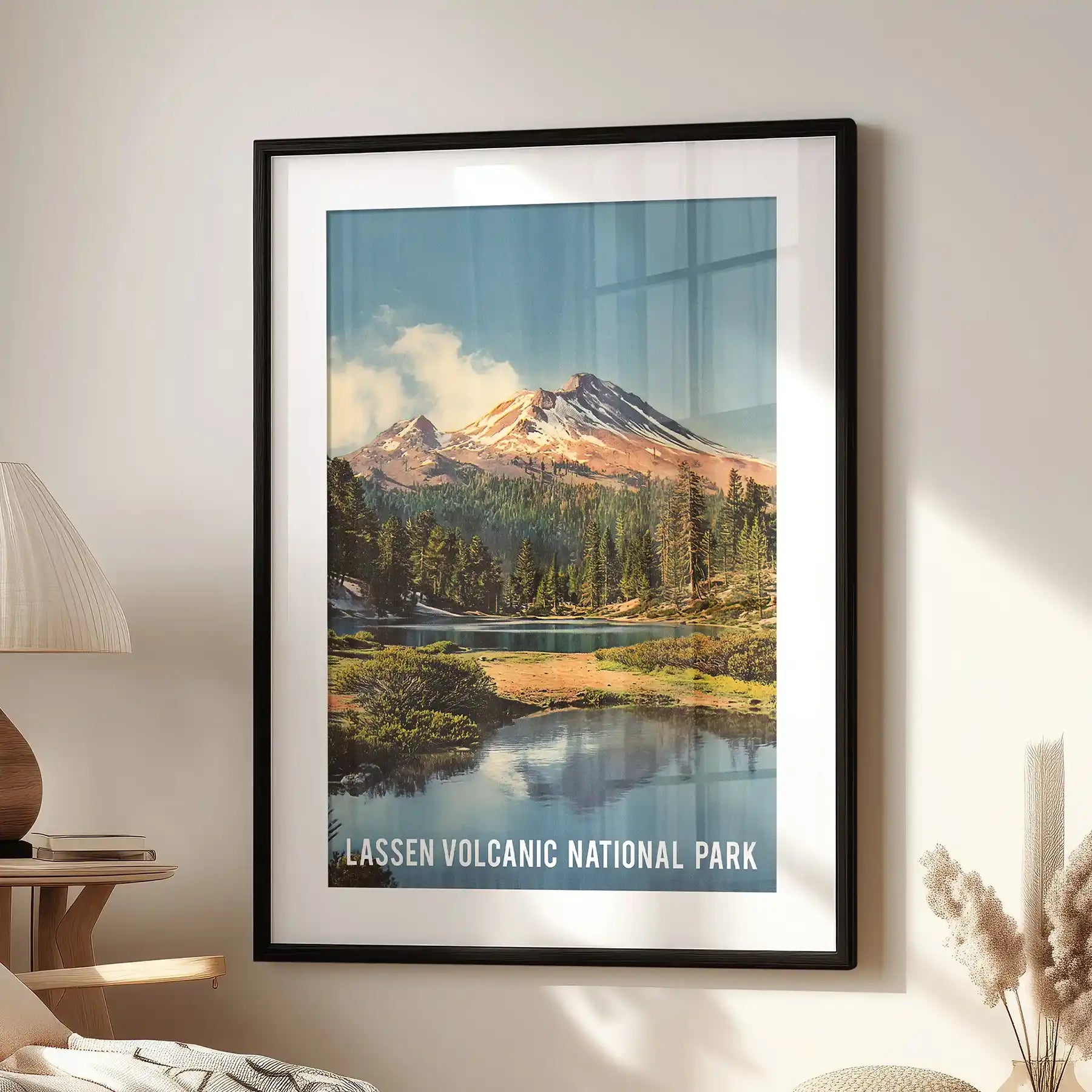 A single-panel wall print of Lassen Volcanic National Park, framed in black mat, hangs over the living room chair with crisp, archival charm.