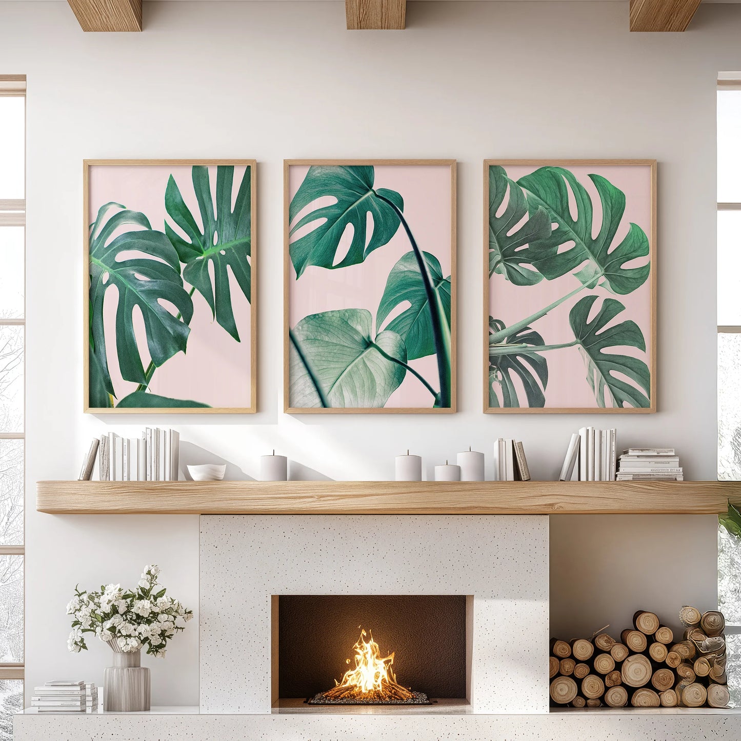 Tropical pink and green foliage 3-piece artwork set, thin wood framed, brings relaxed wall art to the family room, styled neatly over the mantelpiece.