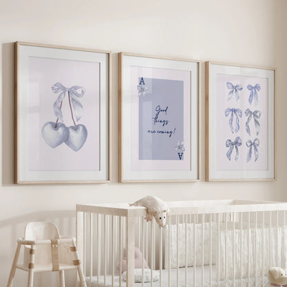 Good Things Are Coming quote prints, three-piece wall art set, rest in oak frames with mats above the cot, casting soothing optimism across the infant room.