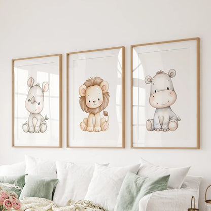 Safari animal prints in three oak frames with white mats hang above a sofa.