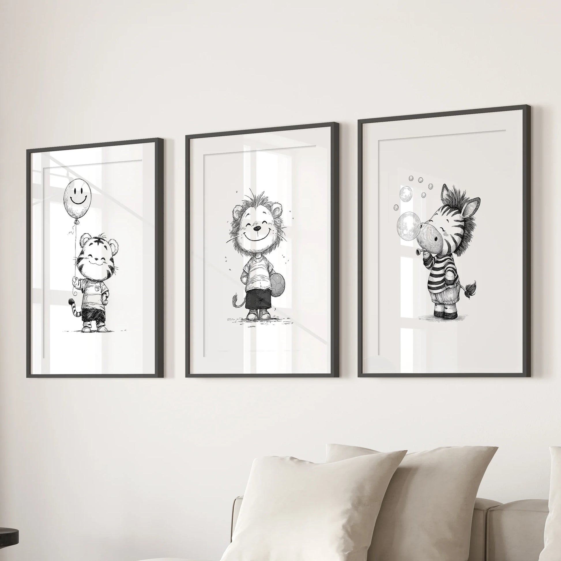 Black-and-white safari animals, three-print artwork in black matted frames, centered over the living room sectional sofa for a crisp gallery feel.