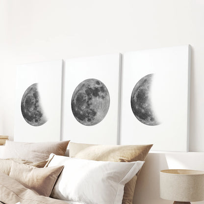 Moon phases sequence 3-piece canvas picture set stretches over the headboard, turning the bedroom wall into a soft, gallery-style slice of night sky.