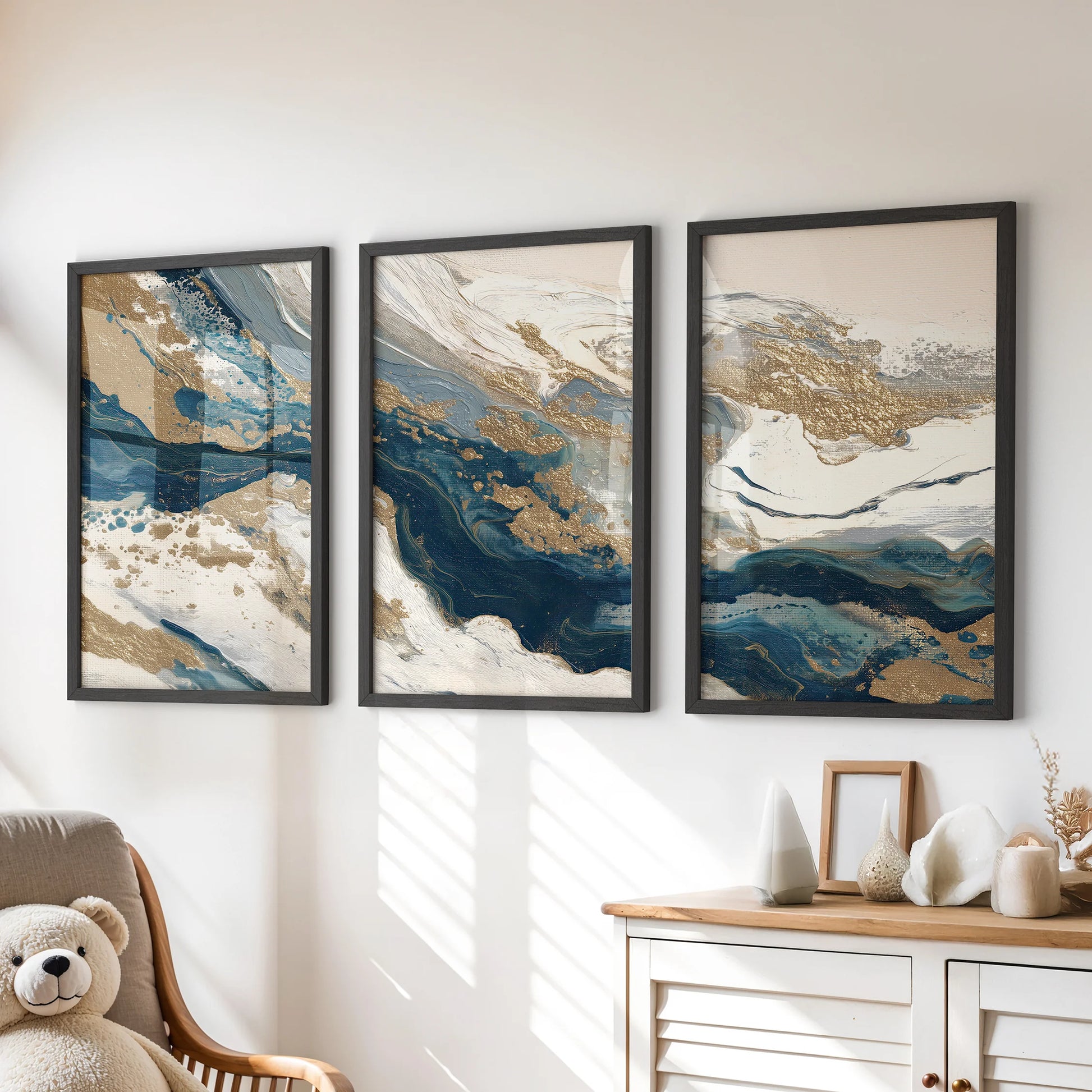 Contemporary oil-paint texture studies, a 3-print wall art set, hover above the children's chest of drawers in sleek black framed prints for quiet depth.