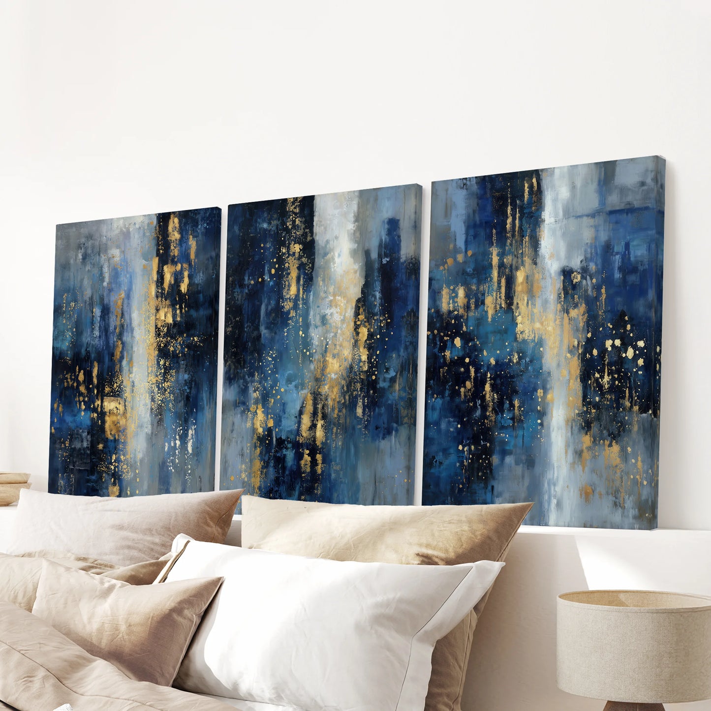 Luxury modern blue-and-gold triptych, a 3-panel unframed canvas set, displayed over the headboard to lend bold texture to the bedroom.