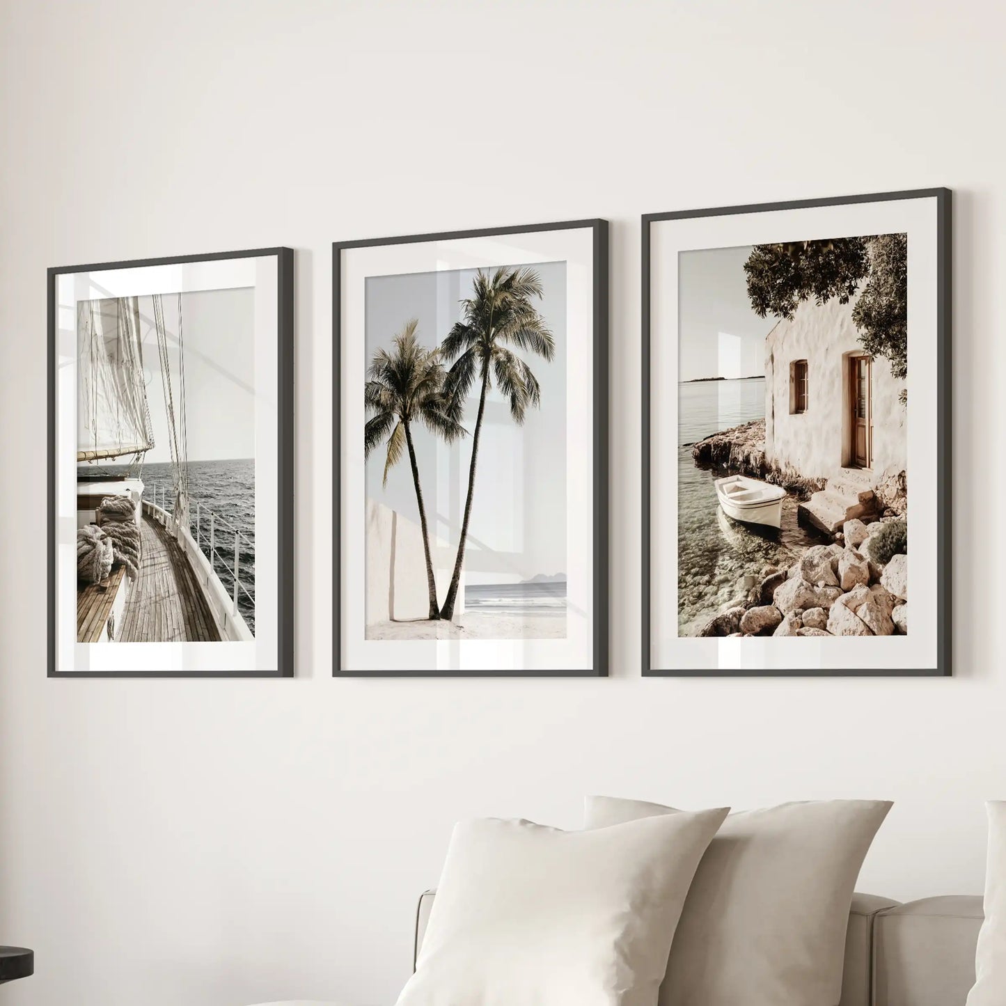 Sailboat prints set of 3 in black frames with mats anchors the family room, mounted above the sectional to bring in breezy coastal calm.
