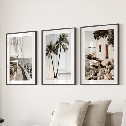 Sailboat prints set of 3 in black frames with mats anchors the family room, mounted above the sectional to bring in breezy coastal calm.
